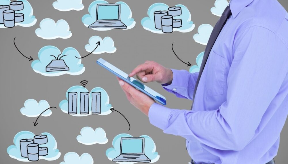 man-with-tablet-clouds-backgroun man-with-tablet-clouds-backgroun